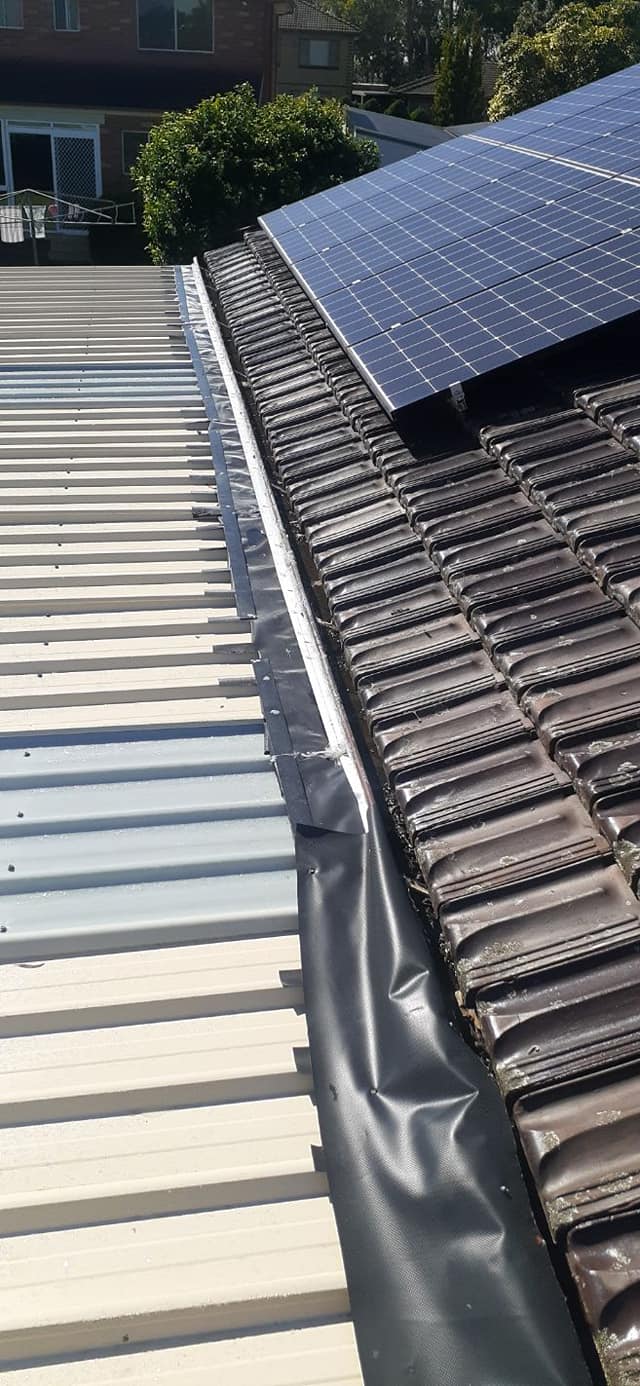Tile to Colorbond flashing alongside solar panels