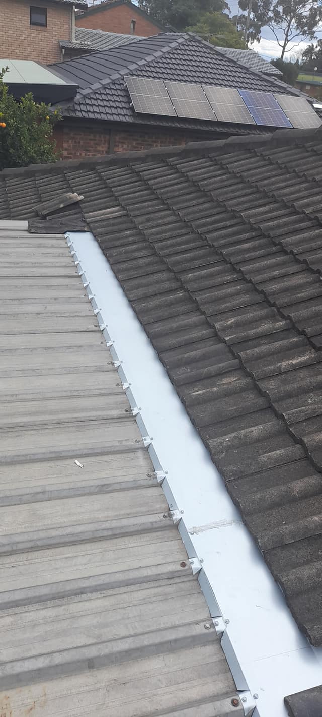 New box gutter and flashing between tile and metal roof