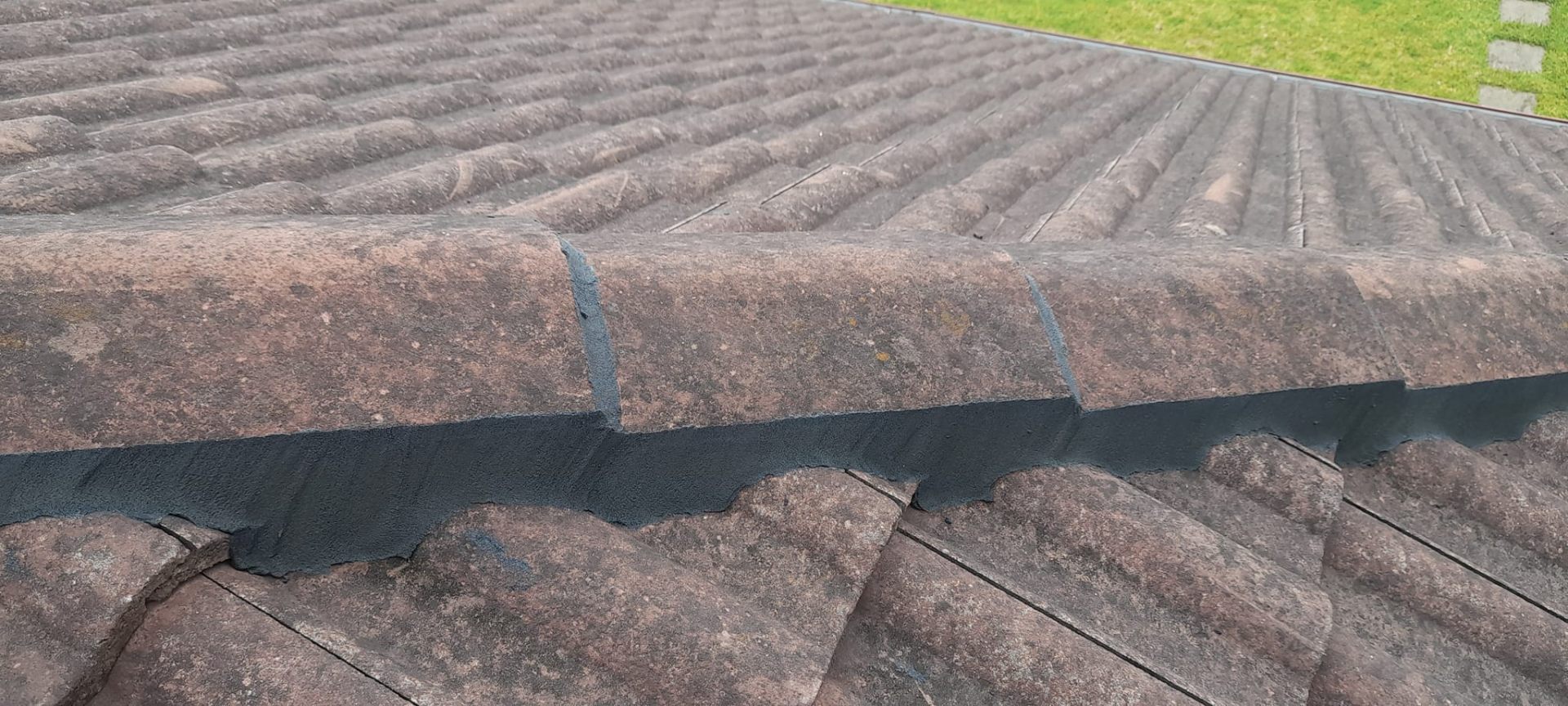 Freshly repointed ridge capping in charcoal